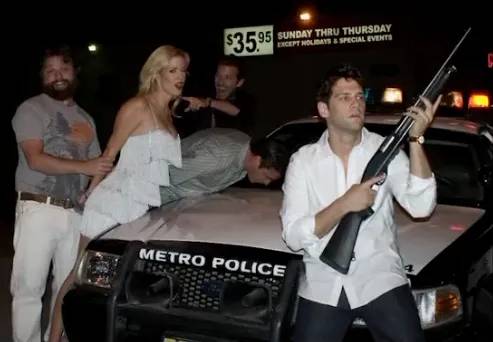 All smiles around the police car. That prop shotgun was probably a terrible idea.